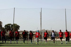 (180311) -- CAIRO, March 11, 2018 (Xinhua) -- Members of the "Miracle Team" have a training session in the pitch of El Salam youth center on the outskirts of the capital Cairo, Egypt on March 9, 2018. Carrying crutches, a group of 40 Egyptian one-legged soccer players have recently formed their "Miracle Team" that aspires to start league for disabled footballers in the country and dreams of joining the amputee football world cup one day. (Xinhua/Ahmed Gomaa)