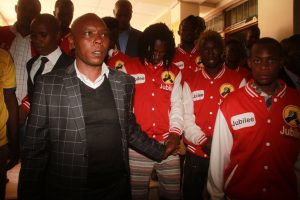 Maina Njenga with his supporters outside political parties tribunal on Monday.