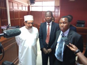 Activists Khelef Khalifa who filed the suit seeking an interpretation of the Constitution in a courtroom with Prof Ben Sianya and another advocate at Milimani law courts on Friday April 7, 2017.
