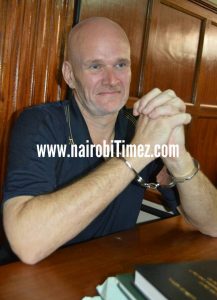 British national -Carl Gary Singletonhandcuffed before a Nairobi Court.
