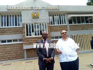 Lawyer Francis moriasi with his client businessman Hiten Raja speaking to journalists outside MAakandara law courts on Friday August 18,2017/PHOTO BY S.A.N.