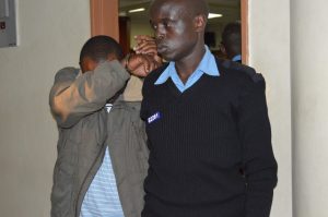 Lawyer Edwin Kirunja Njagi escorted to Milimani law court basement cells on Wednesday August 23,2017